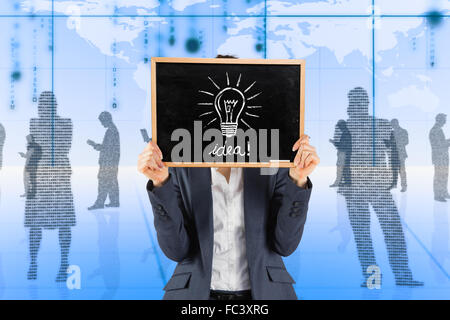 Composite image of businesswoman showing board Stock Photo