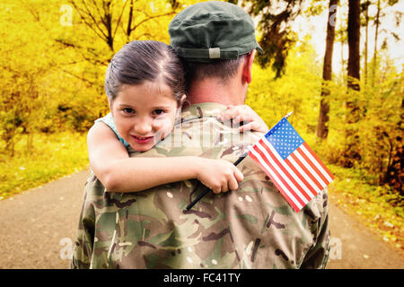 Composite image of soldier reunited with his daughter Stock Photo