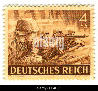 GOMEL,BELARUS - JANUARY 2016: A stamp printed in Germany shows image of the German soldiers, circa 1943. Stock Photo