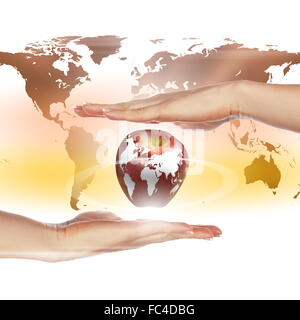 hands holding an apple representing our planet earth Stock Photo