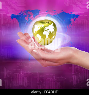 hands holding an apple representing our planet earth Stock Photo