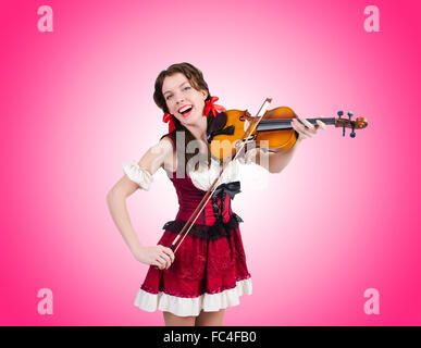 Young woman playing violin against gradient Stock Photo