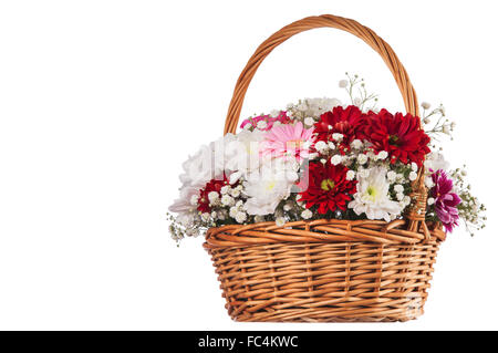 Beautiful bouquet of bright flowers in basket isolated on white Stock Photo