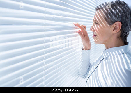 Businesswoman looking through stores in the office Stock Photo