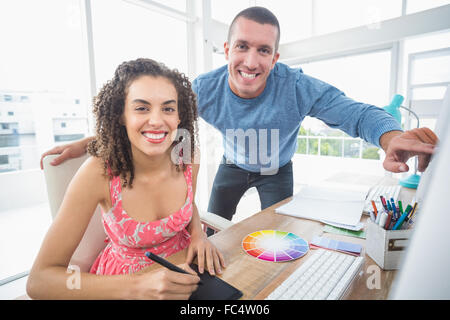 Creative business colleagues working on computer Stock Photo