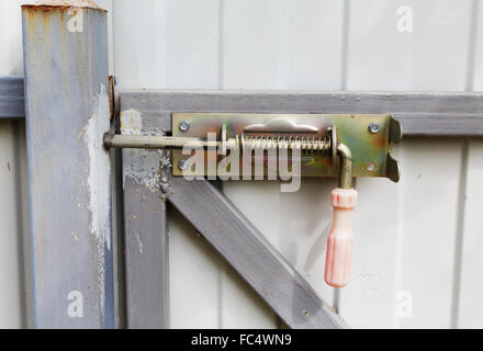 locking bolt on an iron fence Stock Photo