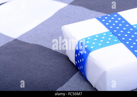 White gift box with blue ribbon Stock Photo