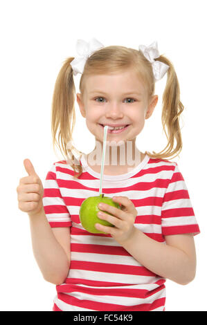 Girl drinking apple juice through straw Stock Photo