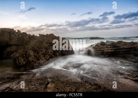 waves on the rocks at Praia do Castelejo Stock Photo