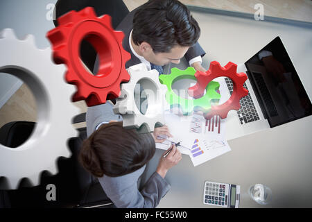 Composite image of white and red cogs and wheels Stock Photo