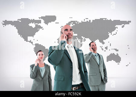 Composite image of business colleagues using phones Stock Photo