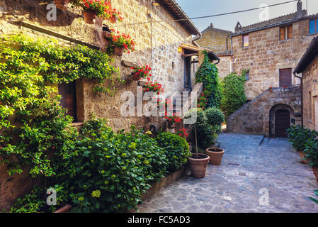 Stairs with colorful flowers in a Tuscan old town Stock Photo