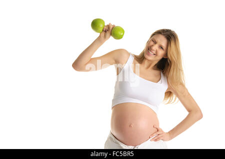 Pregnant woman involved in fitness Stock Photo
