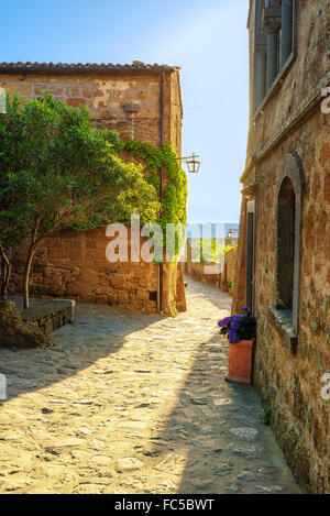 Sunny narrows on a summer day in an old Italian town Stock Photo