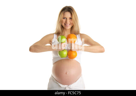 Pregnant woman involved in fitness dumbbells Stock Photo