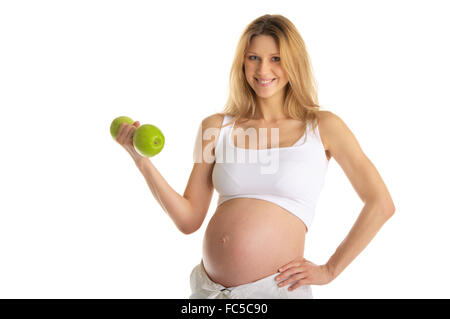 Pregnant woman involved in fitness Stock Photo
