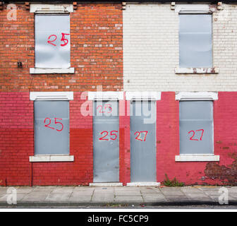 Boarded up houses in street used to house asylum seekers in Middlesbrough, north east England, UK Stock Photo