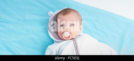 Baby on a blue blanket Stock Photo