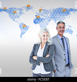 Composite image of  smiling businesswoman and man with arms crossed Stock Photo