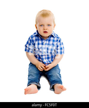 little boy in a plaid shirt and jeans Stock Photo
