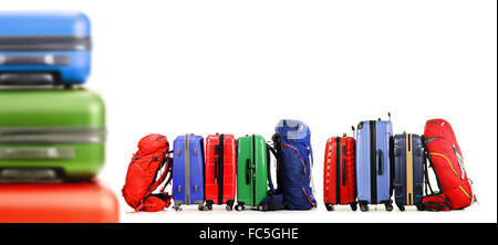 Luggage consisting of large suitcases and backpacks isolated on white. Stock Photo