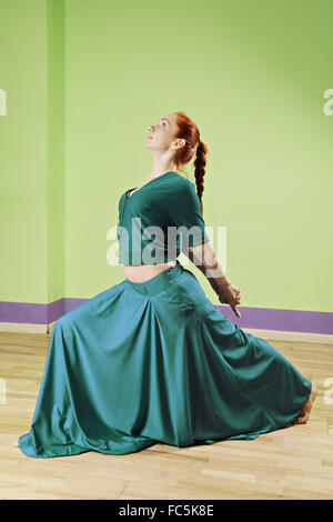 Dancer in green dress Stock Photo