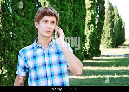 Young man is talking on the telephone Stock Photo