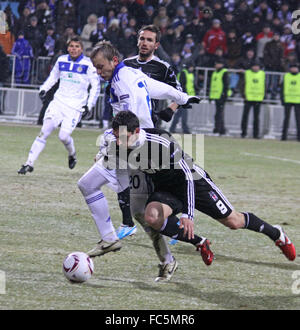 KYIV, UKRAINE - FEBRUARY 24: Oleg Gusev of Dynamo Kyiv (#20, in white) fights for a ball with Roberto Hilbert of Besiktas (#9) d Stock Photo