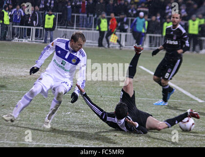 KYIV, UKRAINE - FEBRUARY 24: Oleg Gusev of Dynamo Kyiv (L) fights for a ball with Roberto Hilbert of Besiktas during their UEFA  Stock Photo