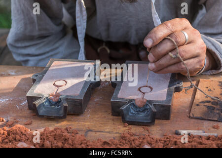 Craftsmen formed a model for metal casting Stock Photo