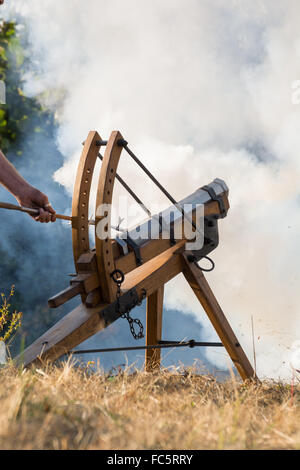 Cannon fire - white smoke in the background Stock Photo