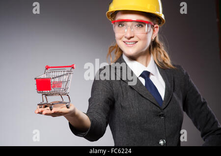 Construction worker in helmet against gray Stock Photo