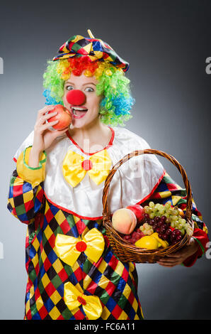 Clown with fruits in funny concept Stock Photo