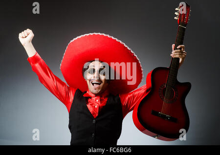 Mexican guitar player in red Stock Photo