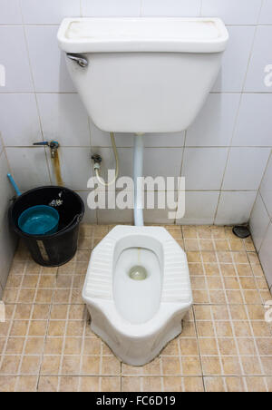 Dirty public toilet of the urban park in Thailand. Stock Photo