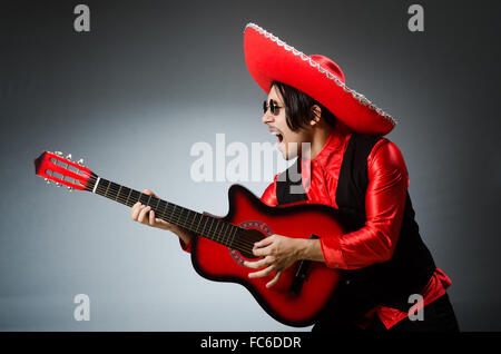 Mexican guitar player in red Stock Photo