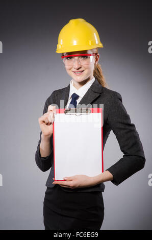 Construction worker in helmet against gray Stock Photo