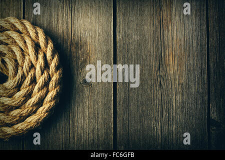 Rope over wooden background Stock Photo