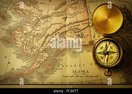 Antique compass over old XIX century map Stock Photo