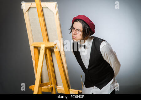 Funny artist in dark studio Stock Photo
