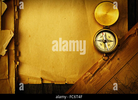Antique compass over old map Stock Photo - Alamy