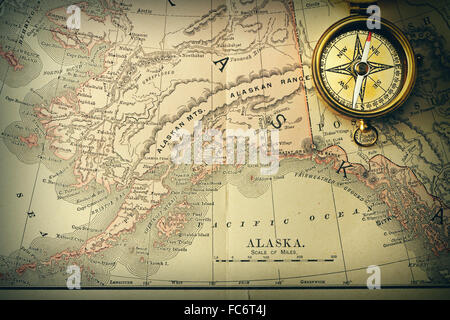 Antique compass over old XIX century map Stock Photo