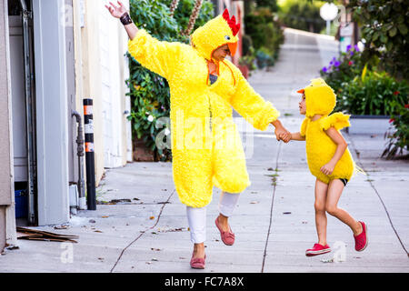 Mother and son wearing matching costumes Stock Photo