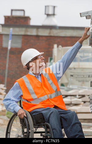 Caucasian engineer working on construction site Stock Photo