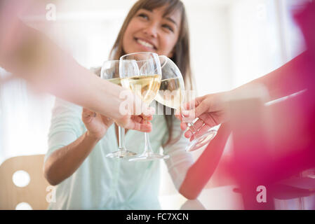 Friends toasting with white wine Stock Photo
