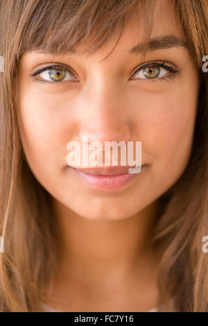 Close up of mixed race woman smiling Stock Photo