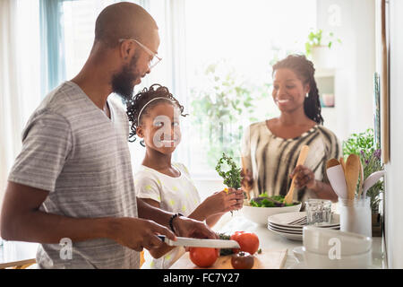 Black family cooking in kitchen Stock Photo
