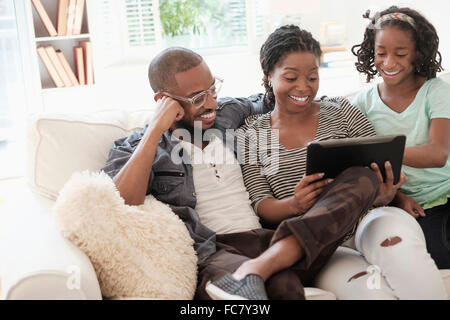 family at home using tablet computer Stock Photo - Alamy