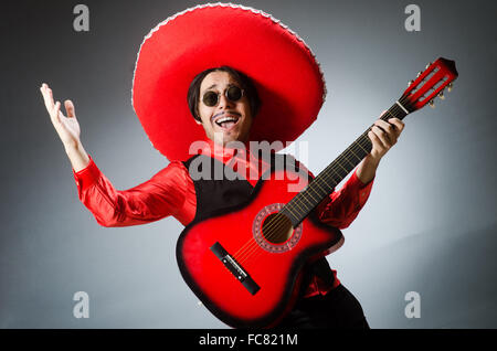 Mexican guitar player in red Stock Photo