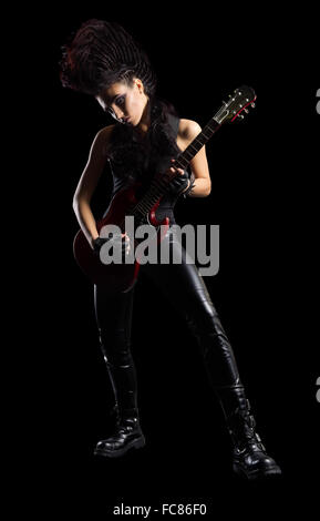 Rock musician with guitar isolated on black Stock Photo